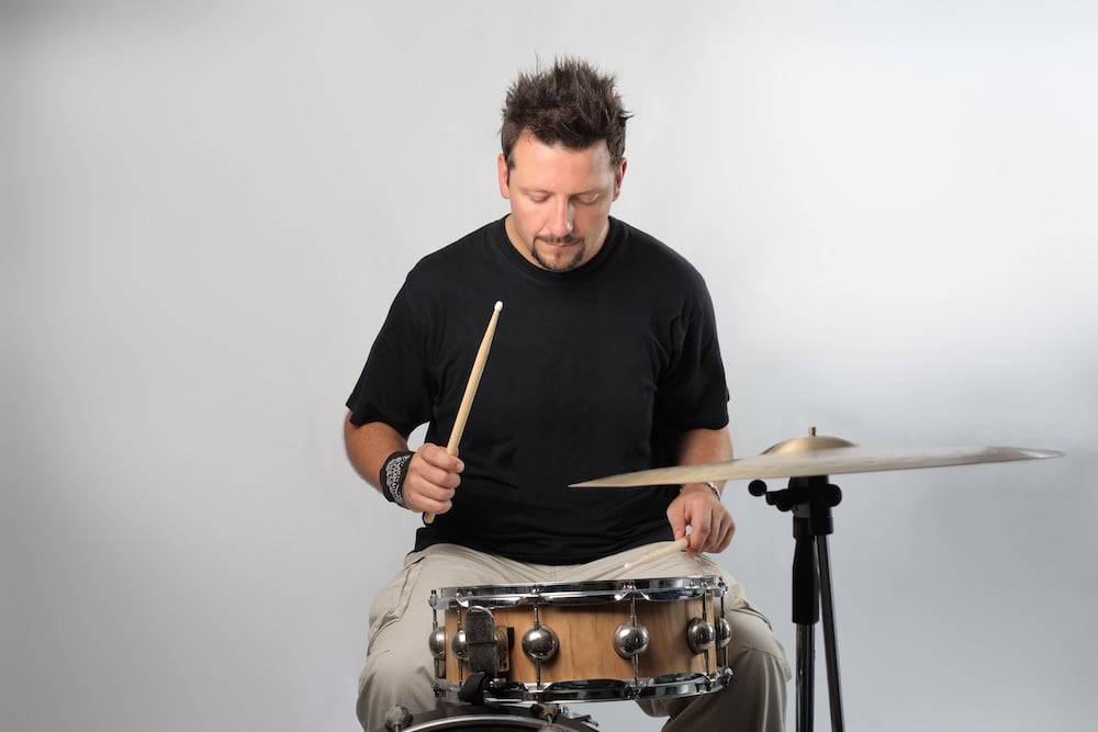 A man learns drums at the music school for adults in Overland Park