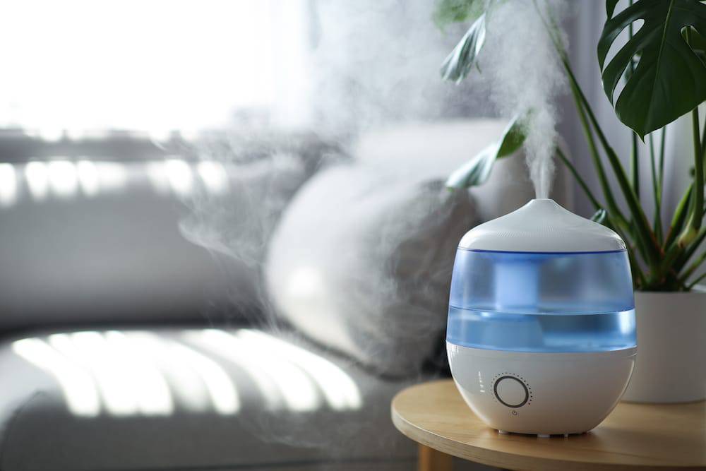 A humidifier sitting on a coffee table