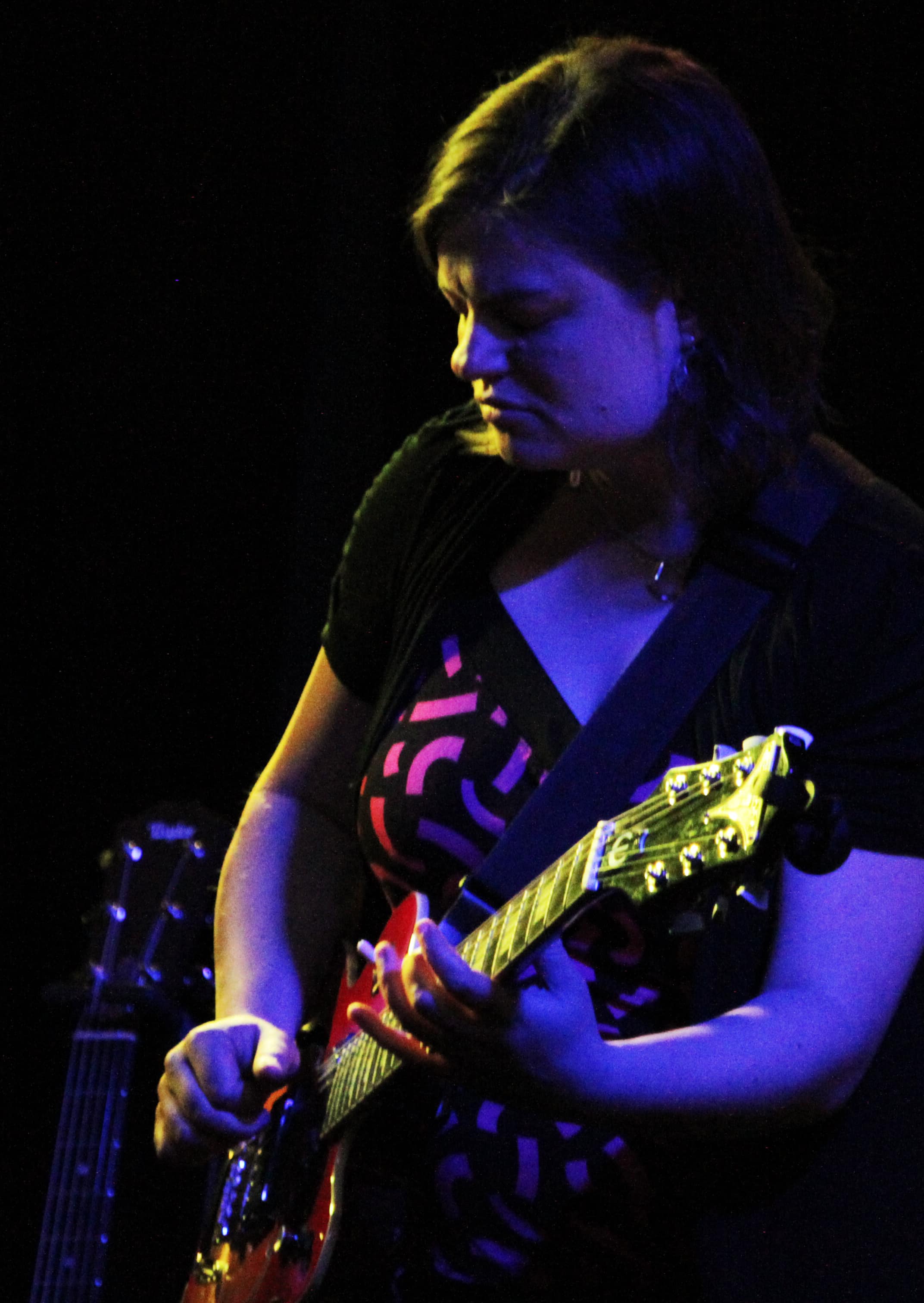 Becca Kephart playing the guitar